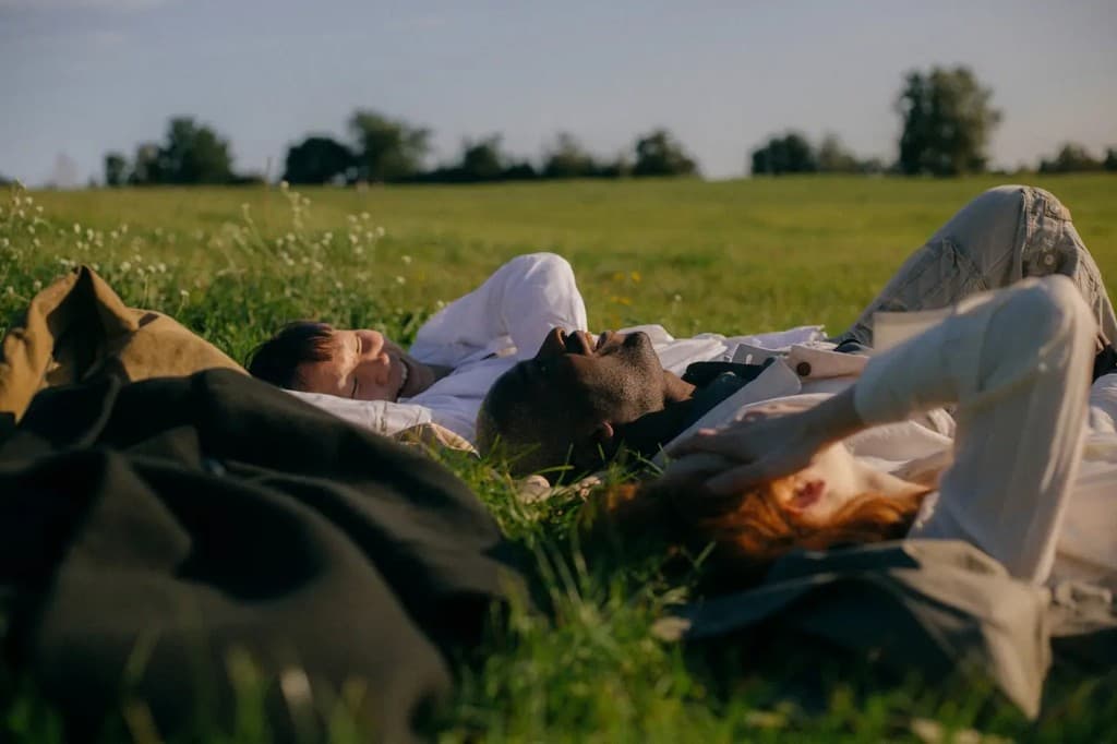 People lying in a field together
